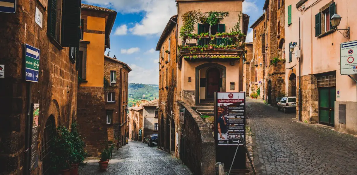 Explore the cobblestone streets and historic architecture of Orvieto, Italy, a picturesque travel destination.