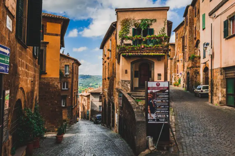 Explore the cobblestone streets and historic architecture of Orvieto, Italy, a picturesque travel destination.