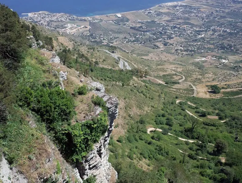 a landscape with a body of water in the back