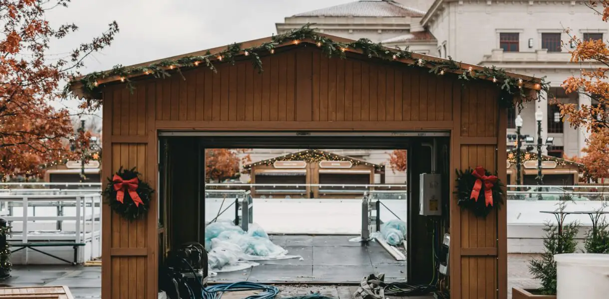 a wooden building with a bunch of decorations on top of it