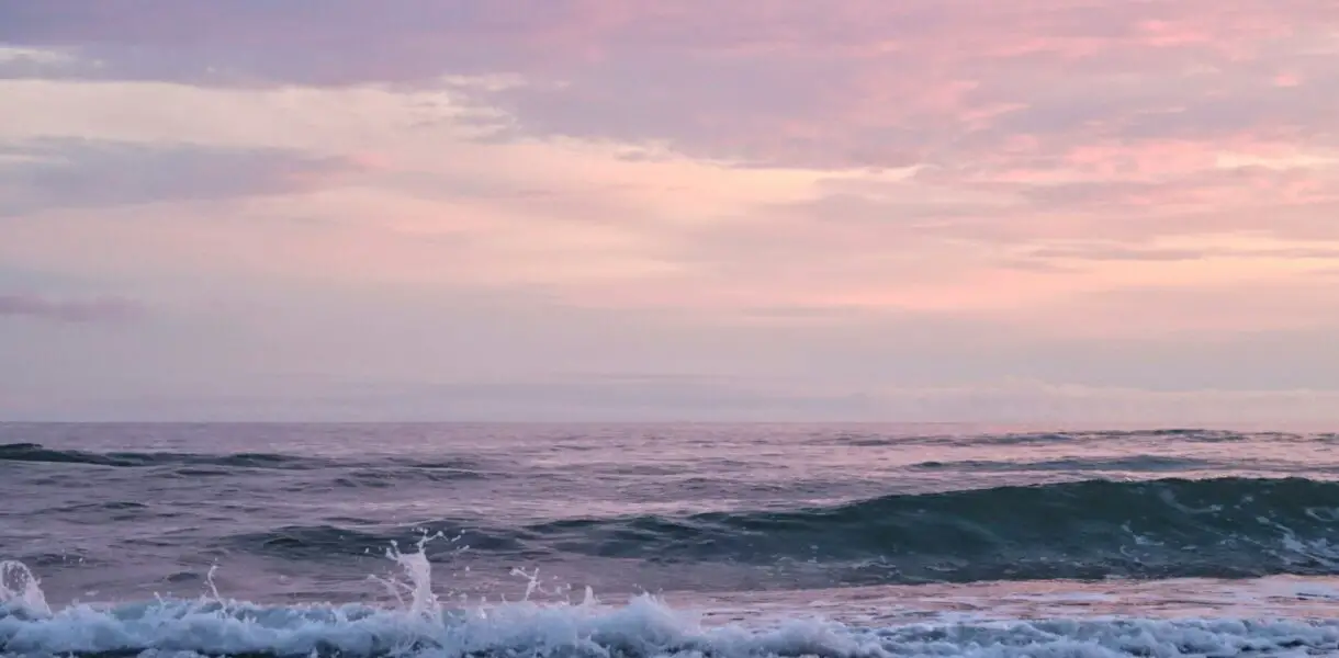 ocean waves crashing on shore during daytime