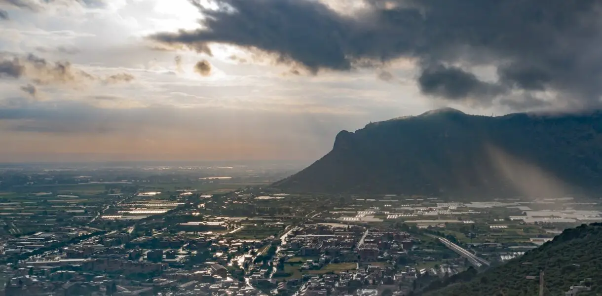 a city with a mountain in the background
